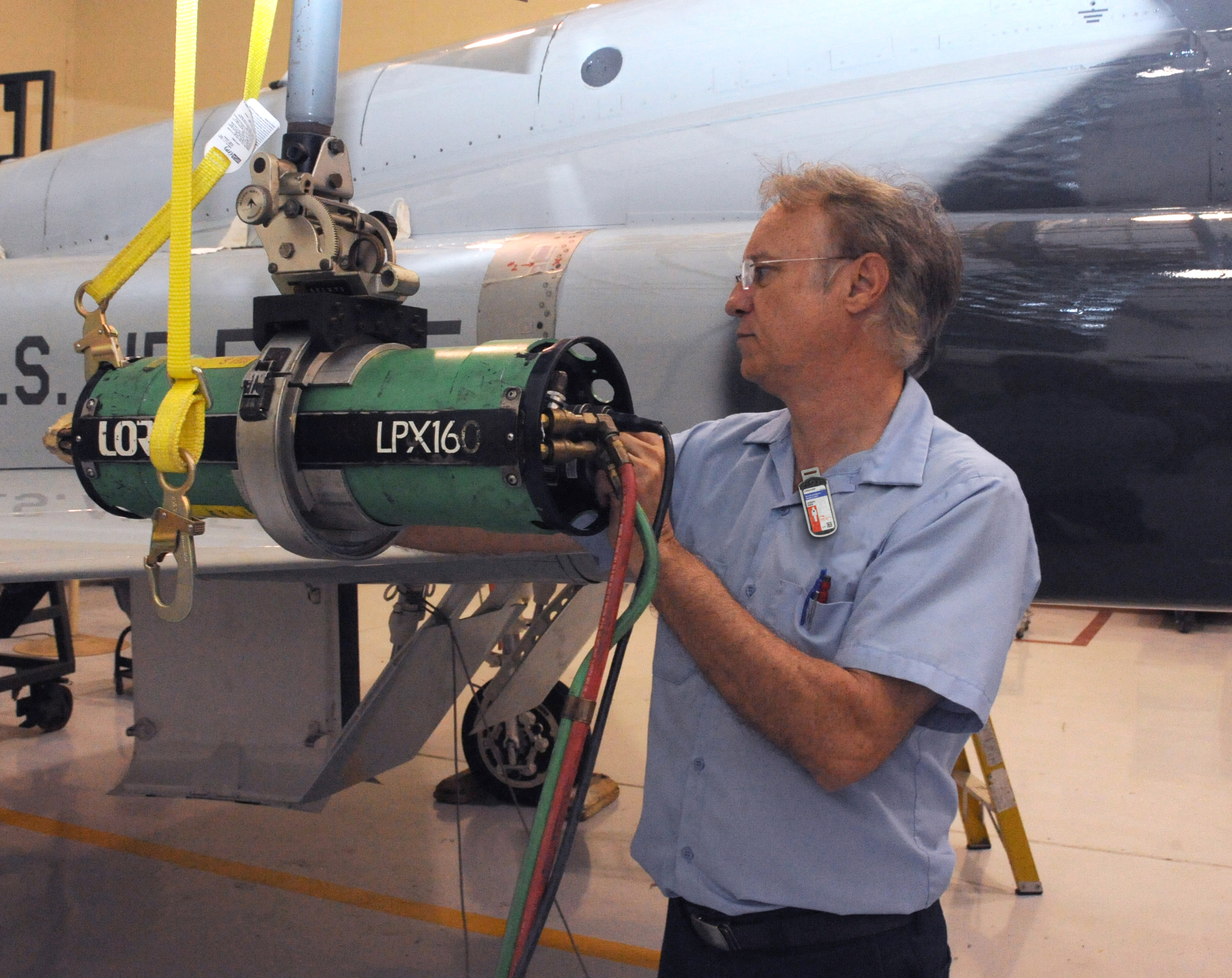 Aircraft carrier worker wearing a Luxel badge