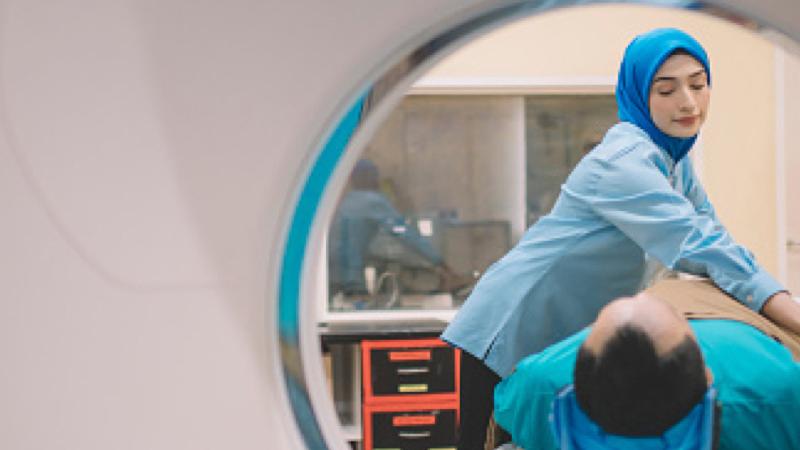 Technician performing a CT Scan