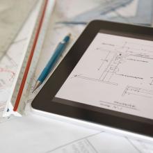 tablet with architectural plans illustrating nationwide availability of imaging shielding design for regulatory compliance