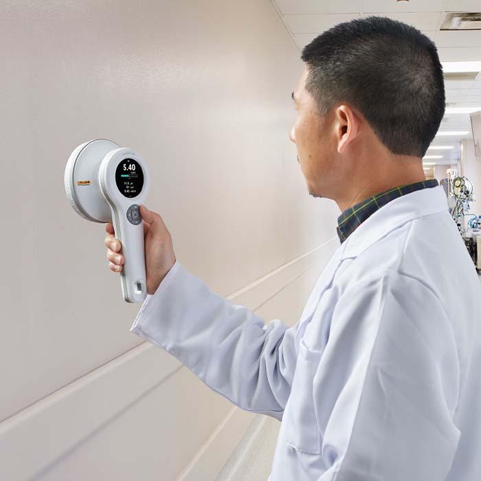 medical physicist conducting radiation survey illustrating nuclear medicine equipment and regulatory support from landauer